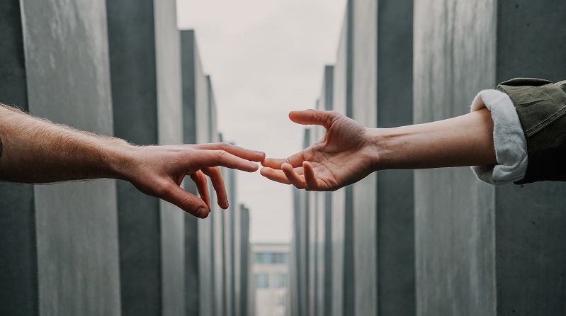 Hands reaching out to touch each other