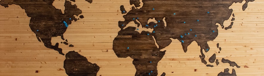 World map with small pins in various locations